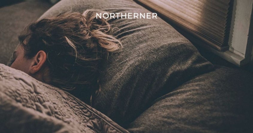 woman asleep on a pillow, nicotine may influence sleep