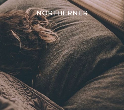 woman asleep on a pillow, nicotine may influence sleep