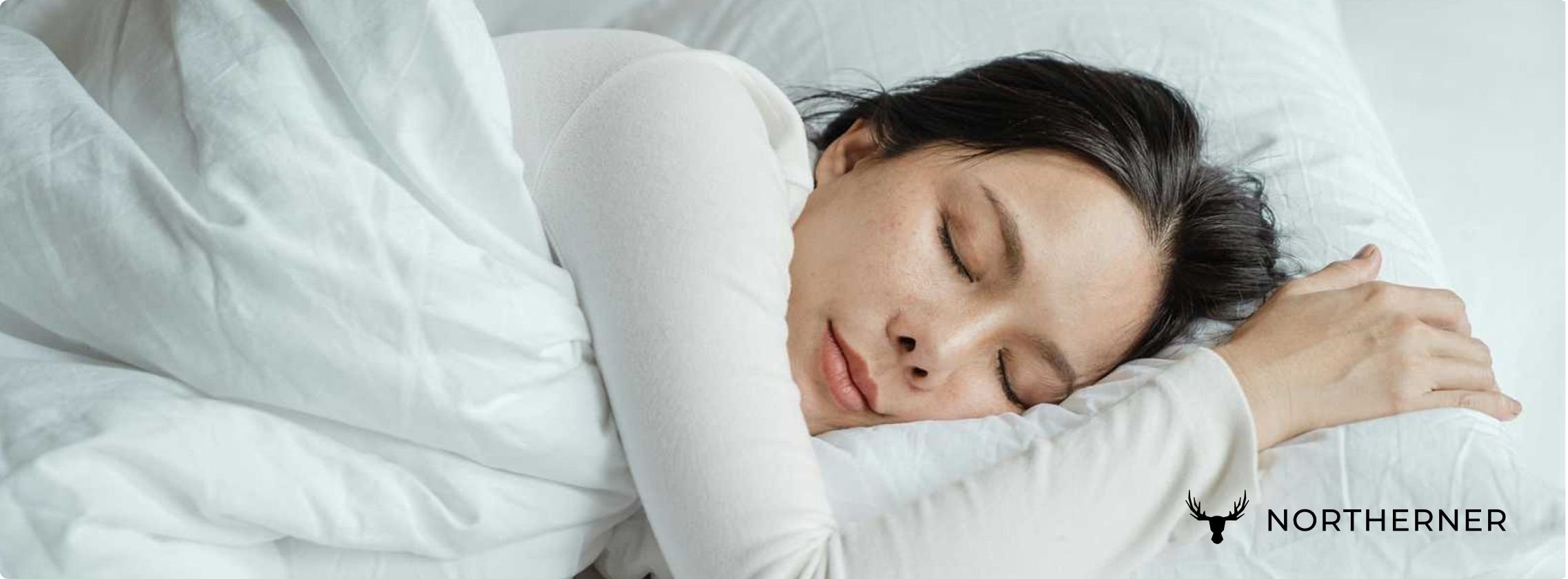 woman sleeping on bed