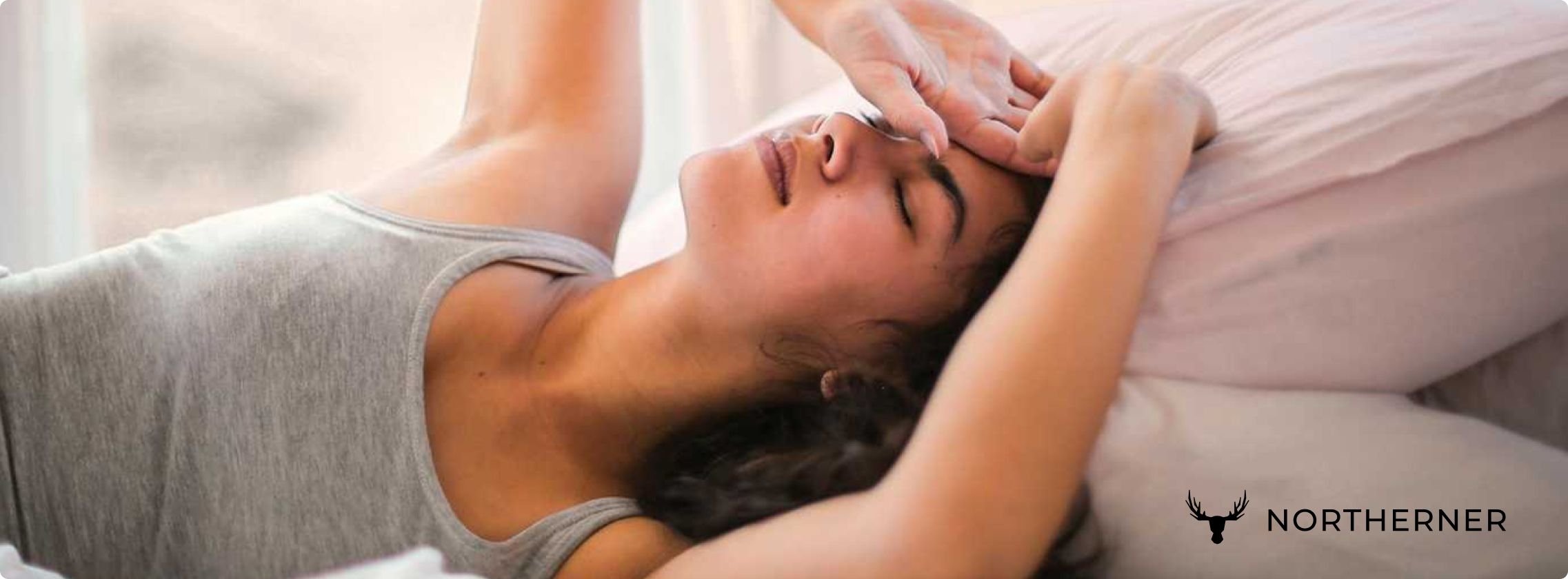 woman lying in bed, struggling to sleep after too much nicotine