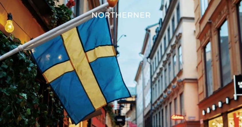Flag of Sweden against background of a street, celebrating Sweden's smoke-free status