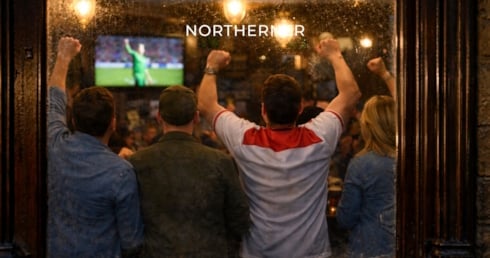 Football fans celebrating a goal, one of many moments missed by smokers taking a cigarette break